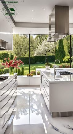 a large kitchen with white cabinets and marble counter tops