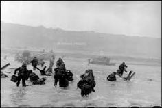 black and white photograph of people in the water