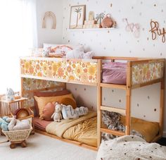 a child's bedroom with bunk beds and toys