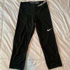 Calf Length Nike Pro Leggings, Never Worn. Nike Go-dry Workout Pants, Nike Black Stretch Yoga Pants, Nike Black Yoga Pants, Sporty Black Nike Yoga Pants, Nike Black Sporty Yoga Pants, Nike Black Yoga Leggings, Nike Black Yoga Pants For Workout, Nike Fitted Black Yoga Pants, Nike Black Leggings For Gym