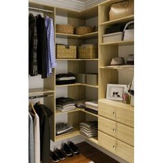 an organized closet with drawers, shelves and shoes on the floor in front of it