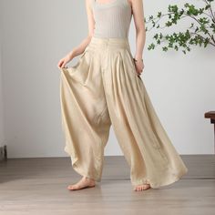 "Cool and comfortable for hot summer days, this apricot wide leg pants is elegant and stylish.    It is a wonderful wardrobe staple that's a timeless classic you'll wear again and again.  All our items are Tailored and Handmade and Made to Order ,I can make Any Size . I design new styles every week, please collect my store. I believe that you will meet your favorite styles. ★★FEATURES Tencel flax Has lining Two side pockets Front zipper closure Wide leg pants Apricot pants Casual pants Long pant Bohemian Summer Pants In Solid Color, Summer Solid Color Relaxed Fit Harem Pants, Summer Casual Wide Leg Harem Pants, Summer Relaxed Fit Solid Harem Pants, Casual Wide Leg Harem Pants For Summer, Baggy Wide Leg Vacation Pants, Bohemian Summer Pants, Baggy Summer Vacation Pants, Summer Vacation Baggy Pants