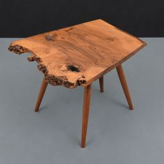 a wooden table that has been made to look like a piece of wood on it