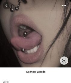 an image of a person with piercings on their nose and tongue that is sticking out