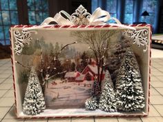 a christmas scene is displayed in a box