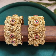 This pair of Indian bangles are perfect blend of modern luxury and traditional style. These bangles are beautifully handcrafted with utmost precision and skill. Our designers have spent hours on this piece to meet your special occasion needs. It is perfect choice for brides, pair this with your rest of the jewelry for a complete royal look. Details & Specifications: Openable kada fits 2 '4 to 2 '8 Luxury Diwali Bangle Jewelry, Luxury Traditional Bangle For Rituals, Luxury Festive Bangle For Gift, Luxury Hand Set Bangle For Diwali, Luxury Intricate Design Bangle For Festive Season, Luxury Flexible Bangle For Wedding, Luxury Spiritual Bangle For Weddings, Luxury Fusion Bangle For Diwali, Luxury Elegant Bangle For Diwali