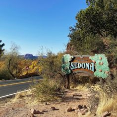 a sign for sedona on the side of a road