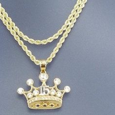 A beautiful crown for the princess that turns 15, all in 14k gold With a 20 inch and 2mm thick, rope style necklace in 14k gold for just $489.00! Pendant is 15mm in height and 20mm width, with zirconia synthetic stones. Gift box is included. Una hermosa corona para la princesa que cumpla sus 15 años en oro de 14k Con una cadena estilos torzal de 20 pulgadas y 2mm de gruesa, en oro de 14k por tan solo $489.00! El pendiente esta 15mm de alto y 20mm de ancho, con piedras zirconia seteticas . Caja d Luxury Gold-plated Rope Chain Jewelry, 14k Gold Rope Chain Jewelry For Gift, 14k Gold Rope Chain Jewelry As Gift, Gold Plated Rope Chain Pendant, Gold Plated Pendant Jewelry With Rope Chain, 14k Gold Crown Design Fine Jewelry, Gold Plated Rope Chain Jewelry For Anniversary, 14k Gold Rope Chain Necklace For Anniversary, Yellow Gold Rope Chain Jewelry For Anniversary