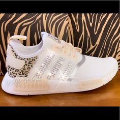 NOTE: Size runs large. Color: White/Platinum with black & beige detail, Leopard Print. Crystals: Swarovski Crystals (clear) on the outer two sides! - Know your size in your particular shoe. We will provide both that box and anew shoebox with your order! White Custom Sneakers, Custom White Sneakers With Studded Outsoles For Sports, White Custom Sneakers With Speckled Midsole, Adidas Custom Sneakers With Cushioned Footbed, Adidas Custom Sneakers With Cushioned Footbed And Round Toe, Custom Adidas, Adidas Originals Nmd, Shoes Outfit Fashion, Adidas Running Shoes