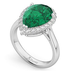 a pear shaped emerald and diamond ring