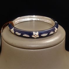 Tommy Bahama Women's Silver Plated Blue Costa Blooms Crystal  Bangle Bracelet Blue Cuff Bracelet Bangle For Formal Occasions, Blue Bangle Cuff Bracelet For Formal Occasions, Formal Blue Bangle Cuff Bracelet, Adjustable Blue Bracelet For Formal Occasions, Blue Round Cuff Bracelet For Formal Occasions, Blue Bracelet Strap Jewelry, Blue Jewelry With Bracelet Strap, Blue Formal Jewelry With Bracelet Strap, Blue Jewelry With Bracelet Strap For Formal Occasions