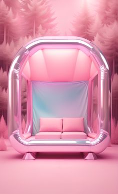 a pink couch sitting in front of a forest filled with trees