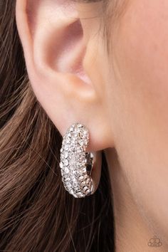 Embellished with an explosion of glittering white rhinestones, silver hoops curl around the ear for a chic, combustible look. Earring attaches to a standard hinge closure fitting. Hoop measures approximately 3/4" in diameter. Sold as one pair of hinge hoop earrings. SKU: P5HO-WTXX-163XX Vintage Paparazzi, Vip Group, The Ear, Paparazzi Accessories, White Rhinestone, Paparazzi Jewelry, White Earrings, Gold Hoops, Kids Jewelry