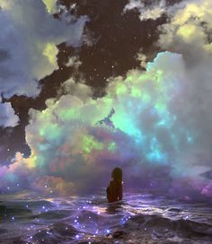 a woman sitting in the ocean under a cloudy sky with stars and clouds above her