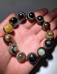 Natural Old Tibetan Agate Dzi Beads " 1 Eye , 2 Eyes " Amulet Bracelet # T655099 Bead Size About : 15.5mm - 16.2mm (Each Bead) Total 13 Beads The buyers are responsible for the customs & duties if it may apply. Polished Agate Beaded Bracelets, Round Agate 8mm Bead Jewelry, Agate Beaded Jewelry With 8mm Beads, Agate 8mm Beads Jewelry, Brown Agate Beaded Bracelets, Round 8mm Agate Beads, Agate Gemstone Beaded Bracelets, Hand-strung Agate Stretch Bracelet, Hand-strung Round Agate Bracelets