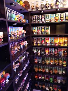 the shelves are filled with many different kinds of pop vinyls