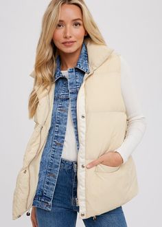 This trendy Sloane Puffer Vest is perfect for adding warmth and style to your wardrobe. With a padded design, denim layered button up front, and zip up closure, it's both functional and fashionable. The high collar adds extra protection against the cold. Available in a relaxed fit, suitable for sizes S/M. Game Day Shirts, Crop Top Sweater, Mom Tees, Crop Top Blouse, Romper Dress, Fall Shopping, Puffer Vest, High Collar, Zip Up