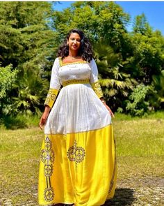 Embrace the beauty of yellow with our gorgeous handwoven Habesha dress. Using Menen fabric, this dress radiates elegance and grace, capturing attention with its vibrant color. The delicate handwoven patterns highlight the artistry of Ethiopian craftsmanship, adding a touch of cultural significance. Made from comfortable cotton material, this dress ensures both style and comfort as you make a striking fashion statement. Traditional Yellow Floor-length Dress, Traditional Yellow Gown, Traditional Yellow Gown For Festivals, Traditional Long Sleeve Yellow Gown, Traditional Gold Maxi Dress, Traditional Yellow Dress For Ceremonies, Traditional Yellow Maxi Dress For Festivals, Yellow Floor-length Dress For Eid, Traditional Yellow Maxi Dress For Festive Occasions