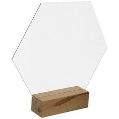 a wooden block with a glass hexagon on the top and bottom, in front of a white background