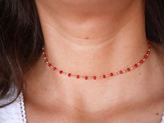 This modern stacking  chocker necklace is made with Gold Plated Rosary Chain adorned with Red Cristal Glass Beads. ➵ Perfect to wear as Chocker or Double turn Bracelet.➵ The necklace length is ajustable thanks to 5 cm extender chain.--*--*--*--*--*--*--*--*--*--*--*--*--*--*--*--*--*--*--∞ SIZE ∞- length: 32 cm (12,6 in) to 37 cm (14,6 in) with the little extender chain.Closing-system : Adjustable∞ MATERIAL ∞- Gold plated over brass- Cristal BeadsNickel free jewelry !∞ COLOR ∞- Gold- Red--*--*-- Trendy Red Beaded Choker Necklace, Trendy Red Necklaces With Round Beads, Trendy Red Round Bead Necklaces, Trendy Red Round Beads Necklace, Trendy Red Choker Necklace, Adjustable Red Dainty Necklace, Red Adjustable Dainty Necklace, Dainty Adjustable Red Necklace, Red Dainty Adjustable Necklace