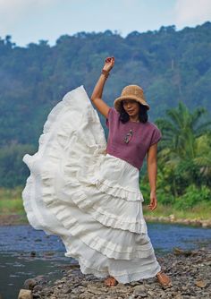 "Boho Maxi Full Circle Wedding Skirt Tiered full circle long skirt made from unbleached and undyed raw cotton in off-white color. Sizing: Made in one size to fit S to L / US: 4/6/8/10/12 Measurement; Elastic waist 24-40\" Hip max 50\" Length 41\" Bottom hem circumference 100\" **Model is a size US 6. 33\" bust, 36\" hip. 165 cm tall** Description: Stunningly beautiful maxi full circle skirt made from raw cotton material. Lined with the same fabric to knee level (not see-through). Full elastic wa Hippie Ruffled Maxi Skirt, Hippie Style Maxi Skirt With Ruffles, Bohemian Tiered Ruffled Skirt, Traditional Tiered Ruffle Skirt, Traditional Long Skirt With Ruffles, Traditional Long Ruffled Skirt, Traditional Flowy Maxi Skirt For Beach, Bohemian Ruffled Flowy Wrap Skirt, Bohemian Flared Wrap Skirt For Beach