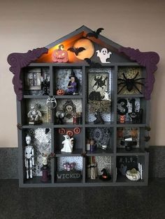 a book shelf with halloween decorations on it