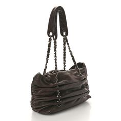 This is an authentic CHANEL Calfskin Timeless Chain Tote in Black. This chic shoulder bag is crafted of luxurious black calfskin leather. The bag features a frontal quilted stitched CC logo and a ruthenium looping chain link leather threaded shoulder strap that is incorporated into the circumference of the bag. The top opens to a gray stain interior with zipper and patch pockets. Gray Stain, Chanel Tote, Leather Thread, Timeless Luxury, Cc Logo, Fendi Bags, Prada Bag, Chain Strap, Dior Bag