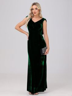 a woman wearing a green velvet dress