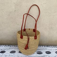 Straw Bucket Bag For Market, Natural Straw Bag Fair Trade, Natural Straw Fair Trade Bag, Jute Bucket Bag For Market, Brown Jute Bucket Straw Bag, Palm Leaf Bucket Bag For Market, Natural Bucket Bag With Braided Handles For Market, Natural Straw Bag With Double Handle For Market, Natural Fiber Straw Bag With Bamboo Handle