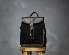 DESIGN This  medium leather backpack is designed and handcrafted in my atelier with high quality leather. Crafted from a soft leather, the backpack is lightweight, but very durable. This backpack is simple and elegant for everyday use: a stylish lunch, a daily walk or a business meeting. It is largely enough to carry  a tablet, an agenda and a book. The bag is lined with two interior pockets and two outside pockets  providing space for little things like keys, glasses, smartphone.   FEATURES -Mu Luxury Leather Backpack For Streetwear, Luxury Leather Backpack Rectangular, Luxury Rectangular Backpack For Gift, Luxury Black Backpack With Leather Trim, Luxury Designer Backpack In Signature Coated Canvas, Luxury Single Compartment Leather Backpack, Elegant Backpacks, Leather Backpack Women, Brown Backpack