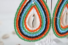 Beaded earrings. Beautifully handmade my Kenyan artisans. Unique Handmade Teardrop Beaded Earrings, Handmade Teardrop Bohemian Beads, Handmade Unique Beaded Earrings With Round Beads, Colorful Beaded Teardrop Earrings For Beach, Teardrop Earrings With Colorful Beads For Beach, Teardrop Beach Earrings With Colorful Beads, Handmade Multicolor Earrings For Beach, Handmade Green Hoop Earrings For Beach, Artisan Handmade Beaded Dangle Earrings