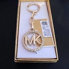 Add Some Mk Love To Any Accessory With This Key Charm By Michael Michael Kors. 18kt Plated Gold Or Rhodium Plated Silver Over Zinc 1"W X 4-1/2"H Item Comes Packaged In A Gift Box 1-Year Manufacturer's Limited Warranty Zinc Spot Clean Imported Luxury Jewelry With Metal Logo, Silver Jewelry With Gold-tone Logo Plaque As Gift, Gold Jewelry With Metal Logo For Gifts, Gold Jewelry With Metal Logo As A Gift, Luxury Jewelry With Metal Logo For Gift, Luxury Jewelry Gift With Metal Logo, Michael Kors Logo, Gold Bag, Rhodium Plated