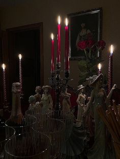 a table with candles and figurines on it