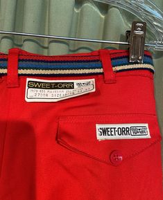 "This is a fun pair of vintage pants from the 1970s or early 80s. These are deadstock with tags still attached. Tagged, \"Sweet-Orr\". Tagged a size 15/16, waist 34, inseam 33. Actual measurements are a little smaller . Waist measures 33. Made of 65% polyester & 35% cotton in bright red. The trousers are high waisted with a metal zipper & button on the waist band & a pleated front. It has belt loops on the waist band & a striped, stretch elastic belt with metal disc buckle. They Shirts Style, Smaller Waist, Elastic Belt, Pleated Bodice, Capri Blue, Trouser Style, Vintage Pants, Metal Zipper, New Wardrobe