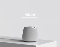 a white object sitting on top of a table next to the words vindu above it