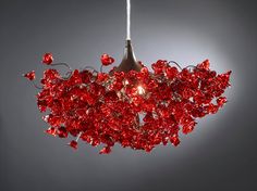 a red light hanging from a ceiling in front of a gray background with the words regular price $ 4800 95