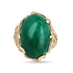 This impressive solitaire ring features a stunning centerpiece in the form of a huge 19-carat oval cabochon cut emerald from Colombia, prized for producing some of the world's most beautiful emeralds. The emerald displays a rich, dark green color that is truly captivating. The emerald is securely set in a unique 14k gold nugget style setting, with nugget prongs that add to the rugged, organic feel of the design. The result is a striking and unforgettable piece of jewelry that is sure to turn heads. Setting Style: Prong-Solitaire  Setting Material: 14K Yellow Gold Setting Weight: 11.0 Grams Main Stone: Emerald Cut: Cabochon Shape: Oval Weight: 19.0-Carats Clarity: Translucent  Color: Green Luster: Very Good Treatments: Natural, Oiling Origin: Colombia Estimated Retail Value: $14,590.00 USD Luxury Green Emerald Ring Oval Cabochon, Luxury Hallmarked Oval Cabochon Emerald Ring, Luxury Polished Emerald Ring, Oval Cabochon, Luxury Green Oval Cabochon Emerald Ring, Luxury Elegant Emerald Ring Oval Cabochon, Luxury Oval Cabochon Emerald Ring With Prong Setting, Luxury Gold Oval Cabochon Emerald Ring, Luxury Emerald Ring Oval Cabochon, Luxury Gold Emerald Ring With Oval Cabochon