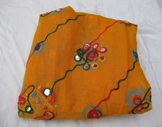 Pattern - embroidered sequin scarf. Ideal for - women/ girls. Occasion - formal or casual. Fabric - cotton. It has an embroidered floral pattern all over. This piece is from the Kutchh area of Gujarat. It is hand-painted and embroidered. Color - On a yellow background, embroidery is done with different colored threads and mirror sequins. Plastic sequins are used because they are lightweight. Size - 40 x 84 inches(approx). Care - gentle hand wash. For more such scarves please visit- https://www.e Sequin Scarf, Beige Scarf, Woolen Scarves, Embroidered Scarf, Yellow Scarf, Boho Scarfs, Green Scarf, Large Scarf, Scarf Gift