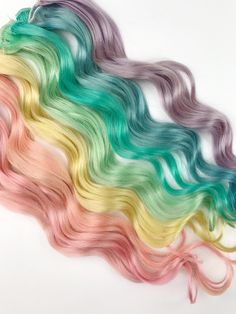 "Unicorn Pastel Please read all of the information below before starting a conversation between seller and buyer. Thanks! Pricing: 2\" wide clip 20-22\" long 10-$140 20-$250 *SHOWN IN PHOTO OF ACTUAL EXTENSIONS* 3\" wide clips 20-22\" in length Set of six=$140 set of 12=$250 Color choice Please let me know how many of each color depending on your package. Pink, peach, yellow, minty green, light turquoise, blue and purple. Each 2\" wide extension is 5-6 grams of hair. The weft is doubled and sewn Pastel Thanksgiving, Tie Dye Tips, Rainbow Hair Extensions, Pink Hair Extensions, Rainbow Tattoo, Pastel Rainbow Hair, Root Color, Rainbow Hair Color, Turquoise Hair