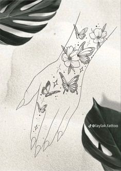 a woman's hand with butterflies on it