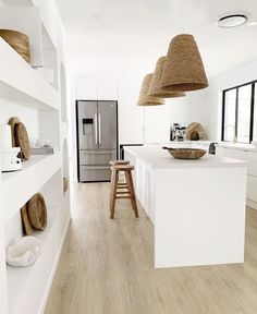 the instagram page shows an image of a white kitchen