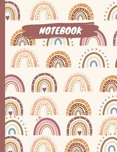 a notebook with rainbows and hearts on the cover is in front of a white background