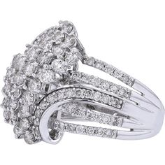 Revel in the sophistication of sheer elegance with the 10K White Gold Diamond Waterfall Ring. This exquisite piece features a stunning array of diamonds cascading down in a mesmerizing waterfall effect, creating a captivating sparkle with every movement. Crafted in lustrous 10K white gold, this ring exudes timeless beauty and modern allure, making it the perfect statement piece for any occasion. The dazzling brilliance of the diamonds, totaling 2 carats, is beautifully complemented by the radiant glow of the white gold setting, adding a touch of luxury to any ensemble. Whether worn as a symbol of love or simply as a stunning accessory, this ring is sure to leave a lasting impression.Details: Exquisite Estate Jewelry: Handpicked from history, this pre-owned piece is a treasure of extraordin Sparkling Cluster Diamond Ring, Glamorous Diamond Ring, Elegant Sparkling Cluster Ring For Anniversary, Glamorous White Diamond Ring For Anniversary, Glamorous White Diamond Anniversary Ring, Formal Sparkling Diamond White Diamond Ring, Glamorous Diamond White Diamond Ring For Formal Occasions, Glamorous Sparkling Diamond Ring For Formal Occasions, Glamorous White Diamond Rings