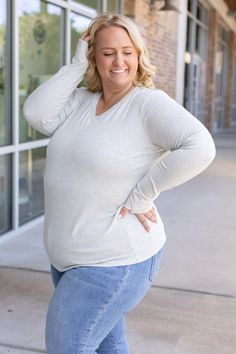 Feel stylish and comfortable with the Leah Long Sleeve Top in Light Grey. This classic design features cozy thumbholes, making it perfect for any adventure, whether indoors or out. With its ideal stretch, it pairs wonderfully with a vest for a versatile and chic look. Fabric: 65% cotton, 30% polyester, 5% spandexFit: True to sizeModel Sizing: Tiffanee is wearing a small, Lexi is wearing a 1XL Athleisure Dress, Graphic Tee Dress, Casual Tops For Women, Pajama Bottoms, Romper Dress, Grey Women, Tee Dress, Casual Top, Clean Design