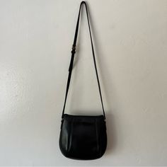 Coach Vintage Crossbody Black Bag Made In The Usa. This Is A True Quality Vintage Crossbody Purse Made Of Genuine Leather. It Has An Open Top With A Metal Closure That Secures Your Belongings. The Length Of The Strap Is Adjustable. It Has Minor Blemishes And Some Wear From Age But Is In Great Condition For Its Age. It Also Has Its Original Tag (Split But Easily Repaired). Vintage Lovers, Coach, Vintage Coach, Genuine Leather, Quality Leather, Coach Lovers, Coach Collectors Versatile Coach Bag With Adjustable Strap, Versatile Coach Bag With Detachable Strap, Versatile Coach Shoulder Satchel, Coach Crossbody Shoulder Bag For Everyday Use, Coach Saddle Bag With Detachable Strap For Daily Use, Classic Coach Crossbody Hobo Bag, Coach Everyday Saddle Shoulder Bag, Coach Everyday Shoulder Saddle Bag, Chic Coach Saddle Bag With Adjustable Strap