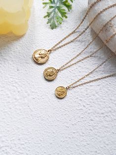 Step out of the ordinary and into a world of elegance with this stunning gold coin necklace. Crafted with 18k gold plated stainless steel, it comes in three size 13mm, 15mm and 18mm. This double-coin pendant necklace is the perfect accessory for any occasion. Whether you're dressing up for a formal event or looking to add a touch of sophistication to a casual outfit, this necklace will have you feeling your best. Plus, this necklace is custom-made to your specifications, ensuring a perfect fit e Gold Plated Tarnish Resistant Coin Necklace, Tarnish Resistant Gold Plated Coin Necklace, Gold Plated Dainty Medallion Necklace, Dainty Gold Plated Medallion Coin Necklace, Round Gold-plated Tarnish-resistant Coin Necklace, Dainty Gold Coin Necklace Tarnish Resistant, Yellow Gold Coin Necklace With Clavicle Chain, Gold Medallion Necklace With Tarnish Resistant Round Disc, Minimalist Coin Medallion Necklace, Tarnish Resistant