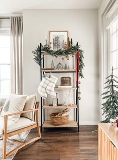 a living room filled with furniture and christmas decorations