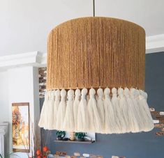 a chandelier hanging from the ceiling in a living room