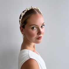 The "Allegra" Crystal and Pearl Bridal Headband is a versatile and timeless accessory that can be styled in various ways. It can be worn with hair down to keep it off your face, or paired with a half up half down or sleek bun hairstyle. Handcrafted with multi-sized pearls and a touch of Genuine Swarovski Crystals, this pearl wedding headband has become a popular choice for modern brides in recent seasons. Made in our Calgary studio, it features a gold headband wrapped in light gold satin for ult Sleek Bridal Bun, Bun With Headband, Updo Sleek, Sleek Bun Hairstyles, Pearl Headpiece Wedding, Elegant Wedding Jewelry, Crystal Headpiece Wedding, Bridal Bun, Pearl Bridal Headband