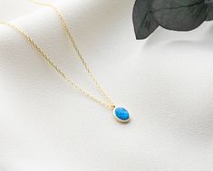 This dainty blue opal necklace ( gold oval opal necklace) is perfect birthday gift a woman. Also, this personalised opal necklace would be a great mother, new mom, daughter, bridesmaid, bride, bridal shower, baby shower, anniversary, grandma, teenage girl, graduation, girlfriend, best friend, engagement, baptism, wedding gift or a treat for you! This minimalist jewellery has been produced with high quality 925k solid silver and available in silver, gold and rose gold colour. You can choose dark blue opal or light blue opal, chain length and colour and you can make your unique jewellery. * great for daily wear * hypoallergenic * nickel-free, lead-free & cadmium-free * chain in different lengths * handmade in the UK * arrives in gift box * can include your gift message (leave in Note to Sell Opal Birthstone Necklace With Oval Pendant, Opal Clavicle Chain Necklace As Gift, Gold Opal Necklace With Oval Cabochon, Opal Necklaces As A Gift, Minimalist Oval Cabochon Necklace For Gift, Daughter Bridesmaid, Best Friend Engagement, Simple Pearl Pendant, Opal Necklace Gold